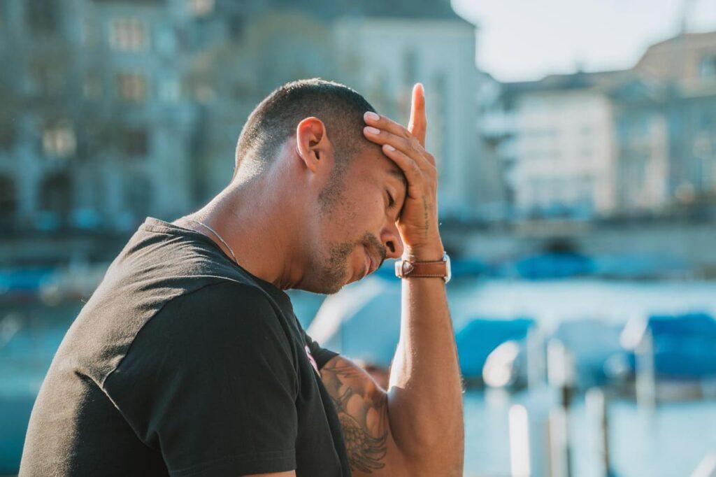 Man thinking about what makes him happy, reflecting on the need for self-improvement.