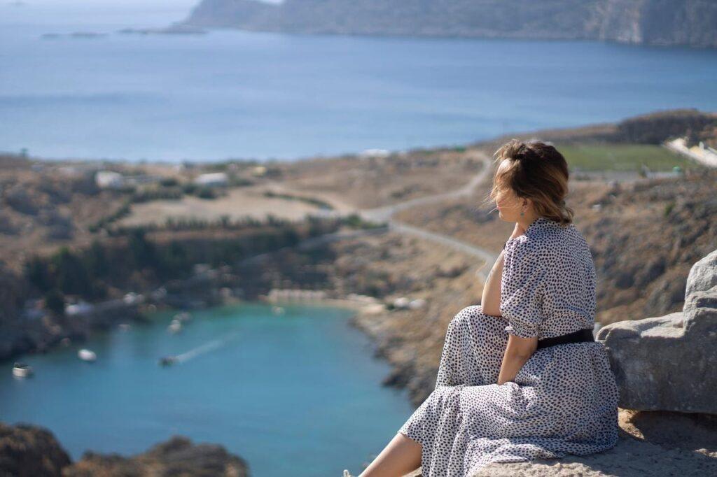 Woman reflecting on her personal development journey.