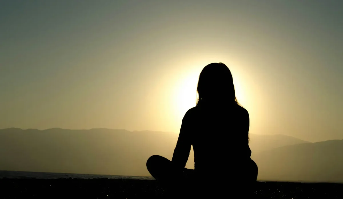 Person practicing mindfulness as one of mindful stress reduction methods.