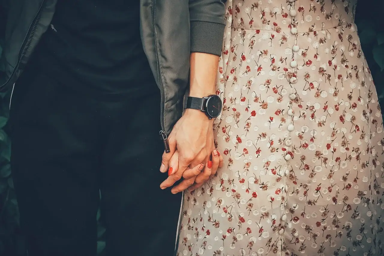 A couple holding hands, they followed healthy relationship tips for couples.
