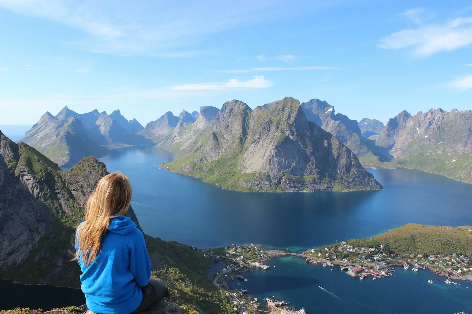 Woman on top of a mountain, reflecting on her dream life.