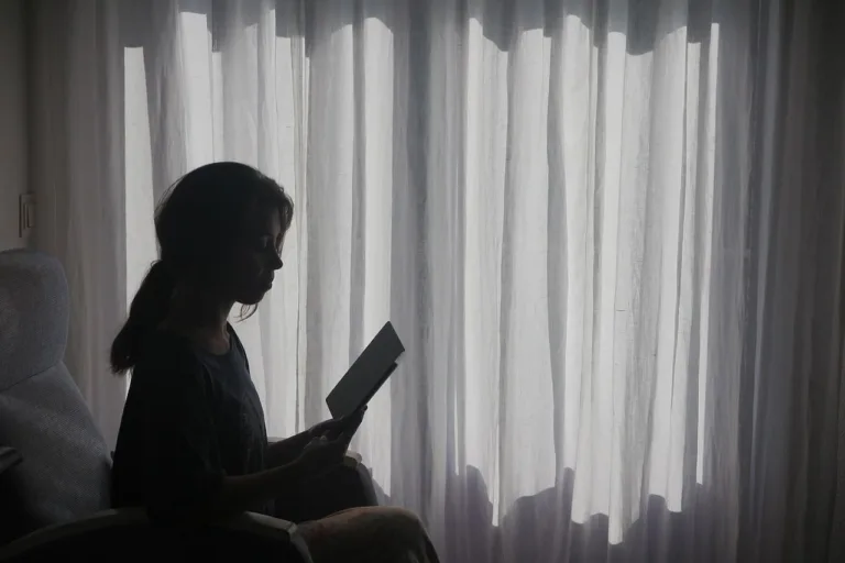 Woman reflecting on her shadow work prompts.