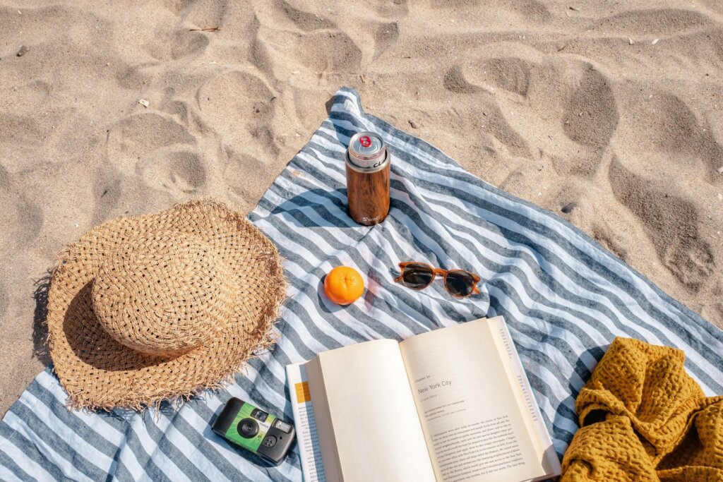 Beach towel with beach essentials.