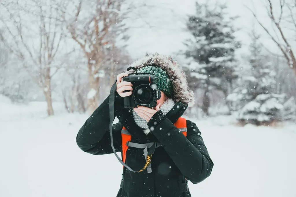 Woman talking pictures with a digital camera, which was on her Christmas wish list for 2025.