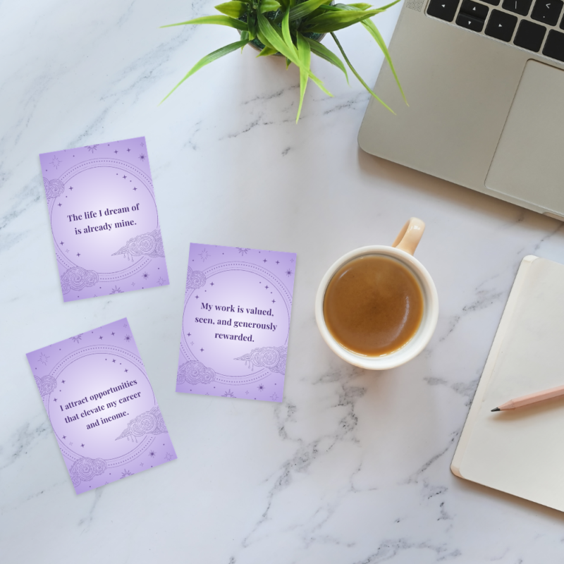 Manifestation affirmations layed out on a desk.