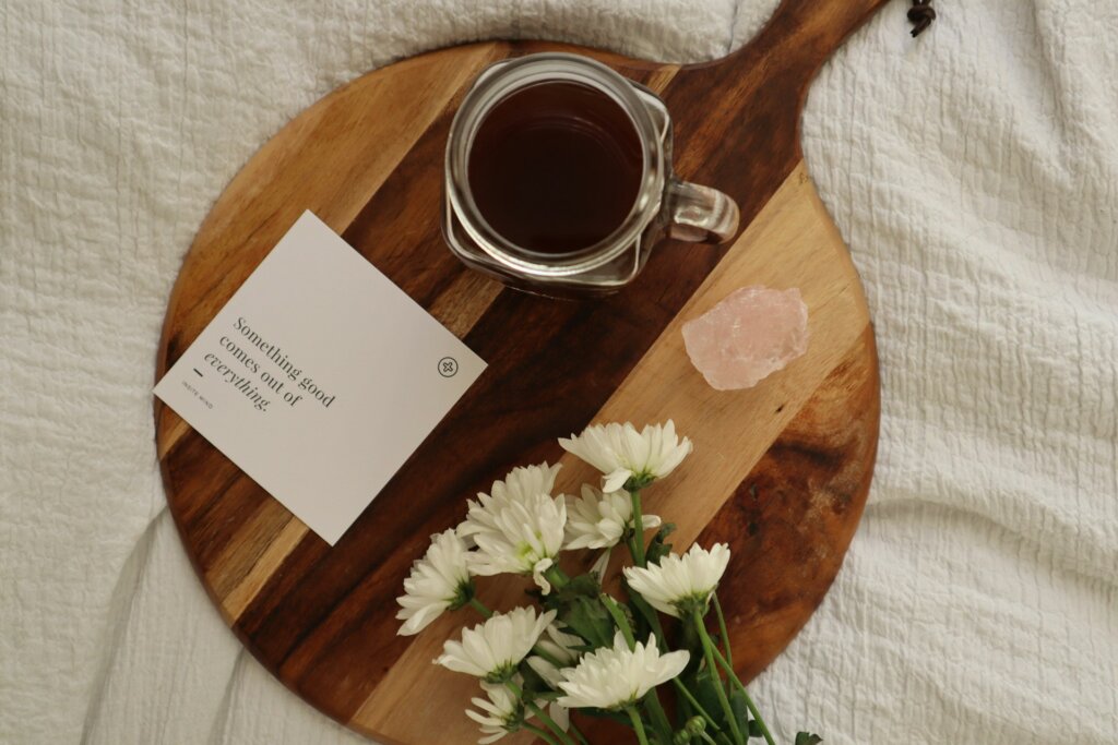 Manifestation affirmation cards laid out on the bed.