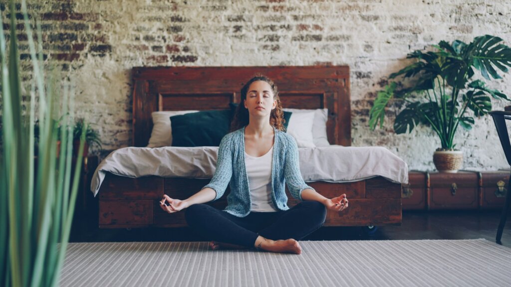 Woman meditating at home.