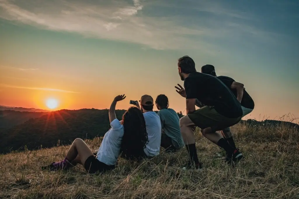Friend group on a hilltop after making friends as an adult.