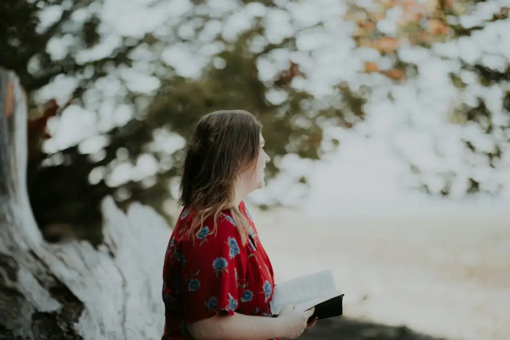 Woman reading the best books on self-respect.