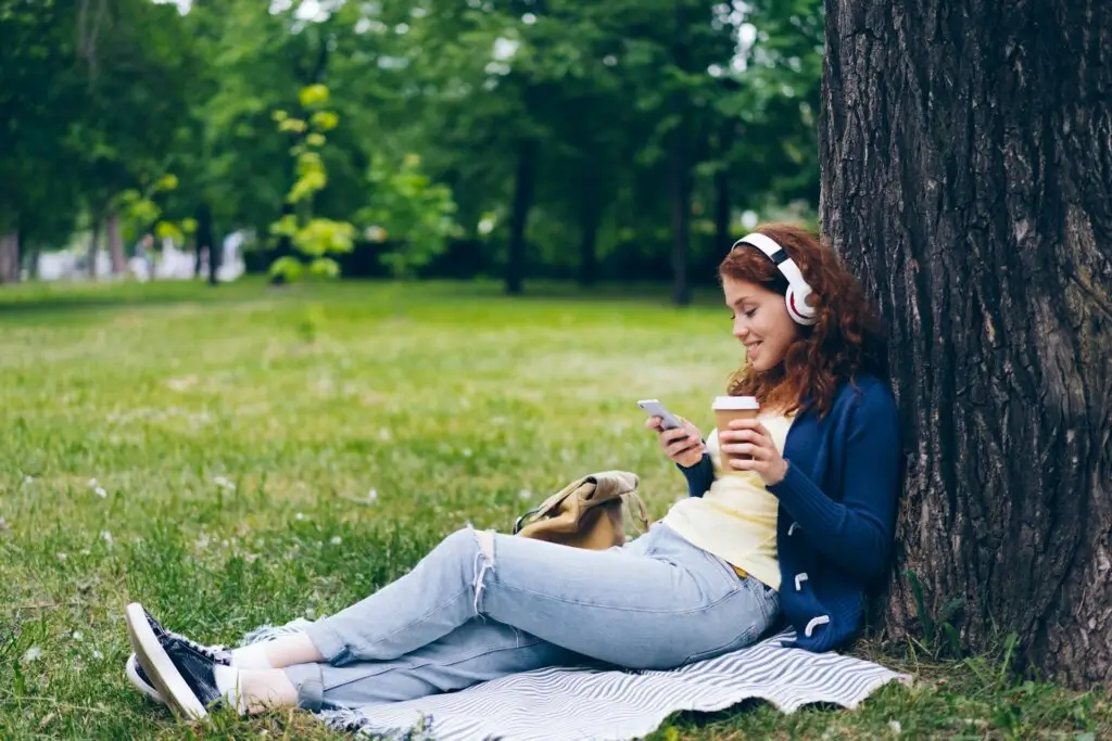 Woman spending time alone, learning how to make friends in a new city.