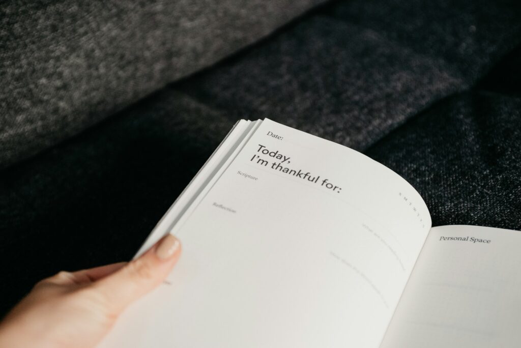 A gratitude journal in woman's hands.