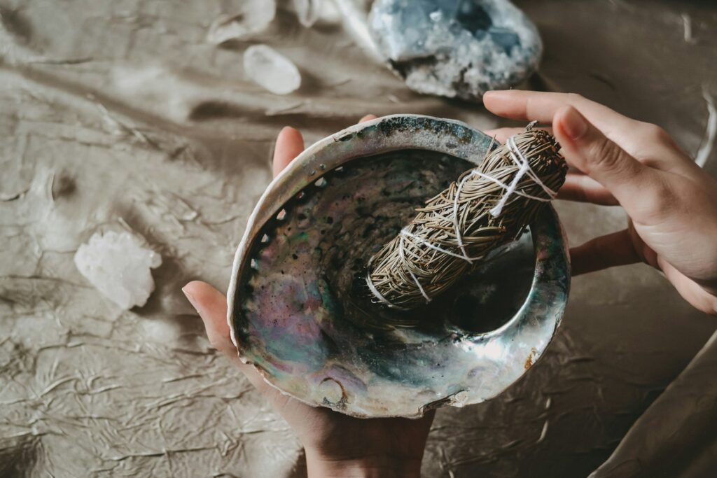 Energy cleansing tools like sage and crystals.